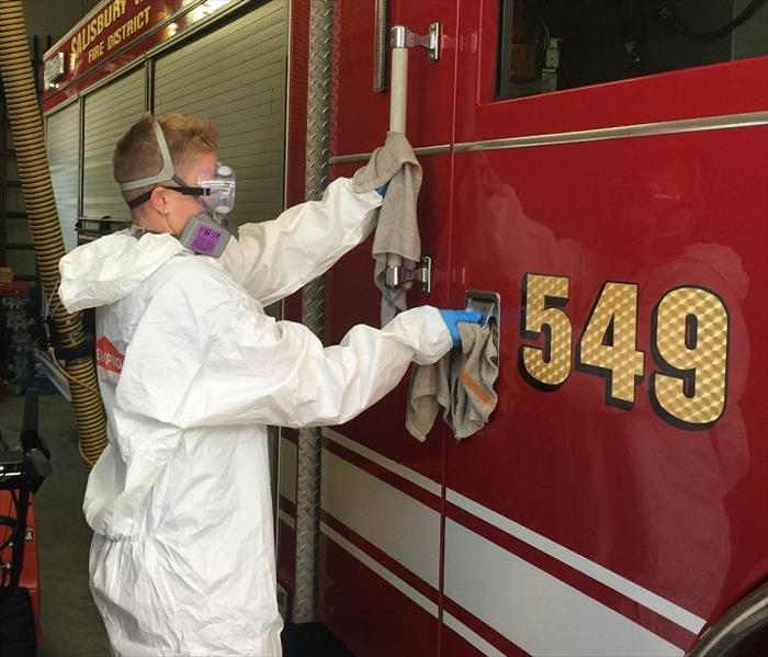 SERVPRO Tech cleaning fire truck