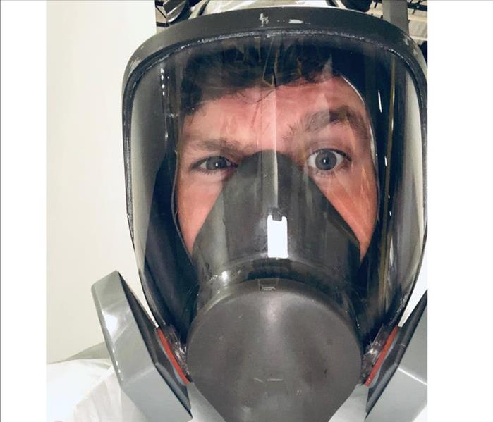 portrait photo of male with a full respirator