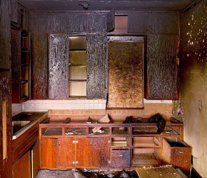 Aftermath: Charred Remains of Kitchen Destroyed by Fire